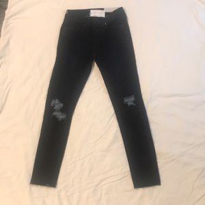 dark wash blue ripped jeans